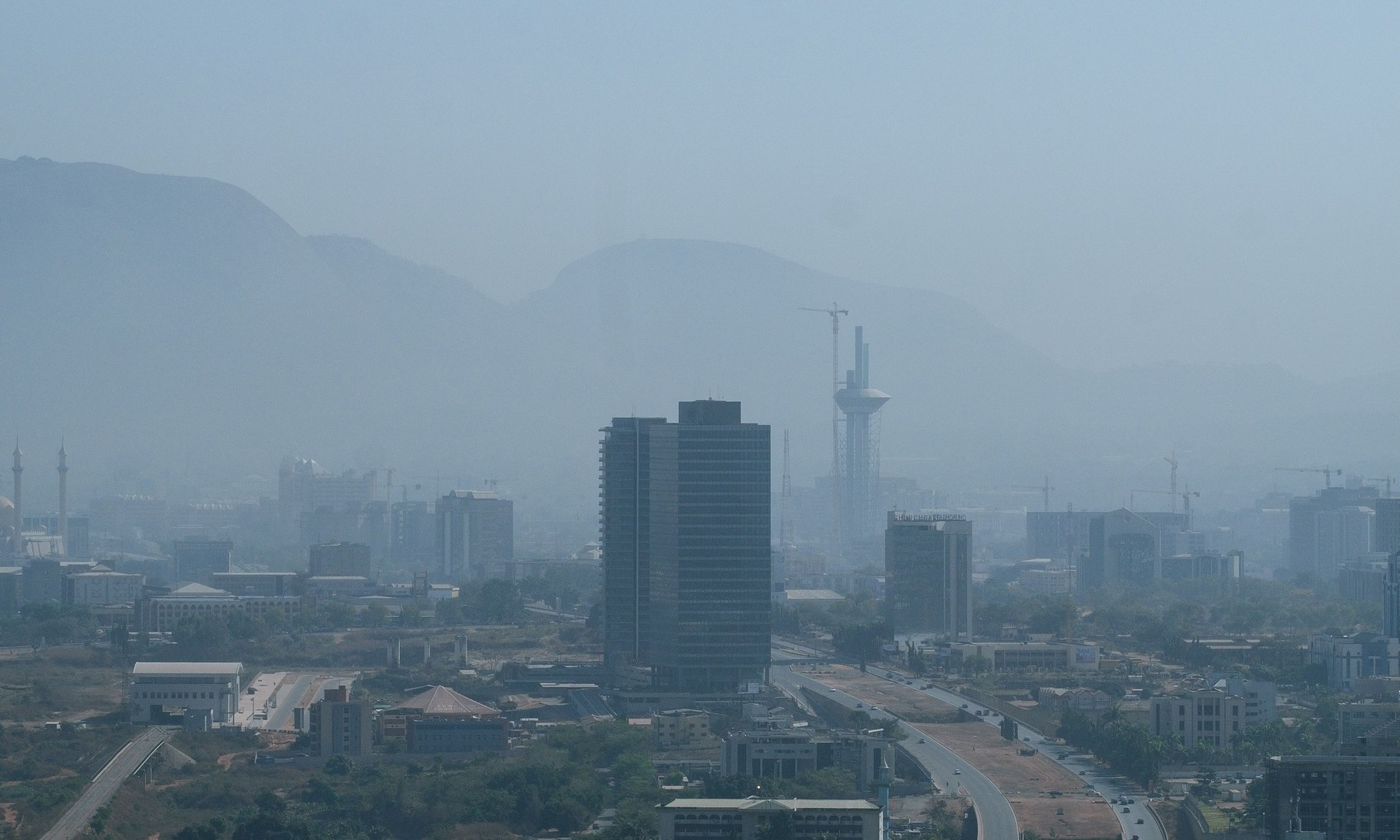 Real aerial photograph of Abuja, Nigeria, showing the city and nearby hills